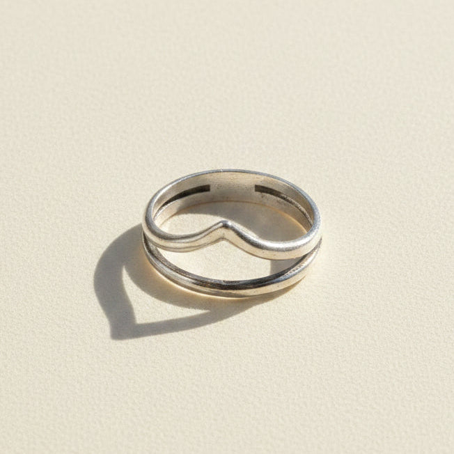 Silver-tone stacked rings with curved cutout center