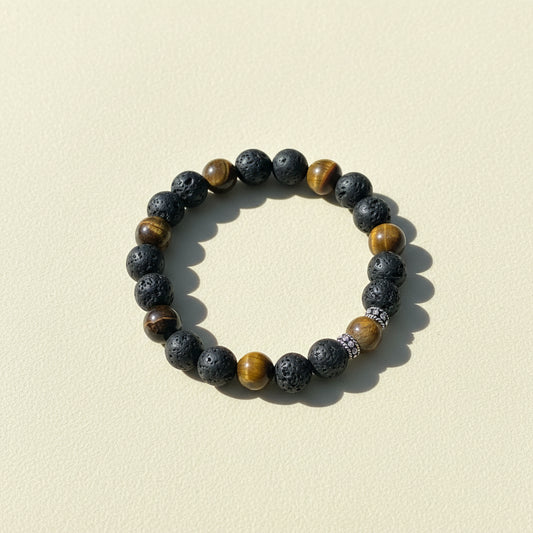 Beaded talisman bracelet with dark stone beads and brown-gold accent beads