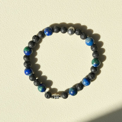 Beaded lava stone bracelet with blue and green gemstone accents, silver clasp