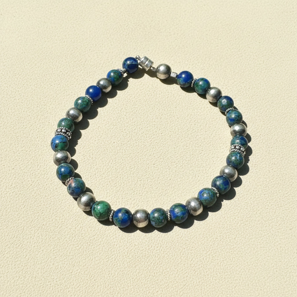 Beaded talisman bracelet with blue, green, and silver round beads