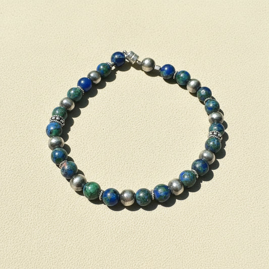 Beaded talisman bracelet with blue, green, and silver round beads