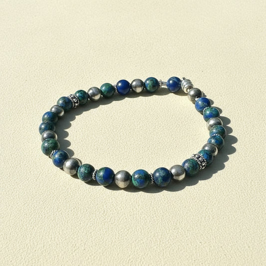 Beaded stretch bracelet with blue and green beads and silver spacers