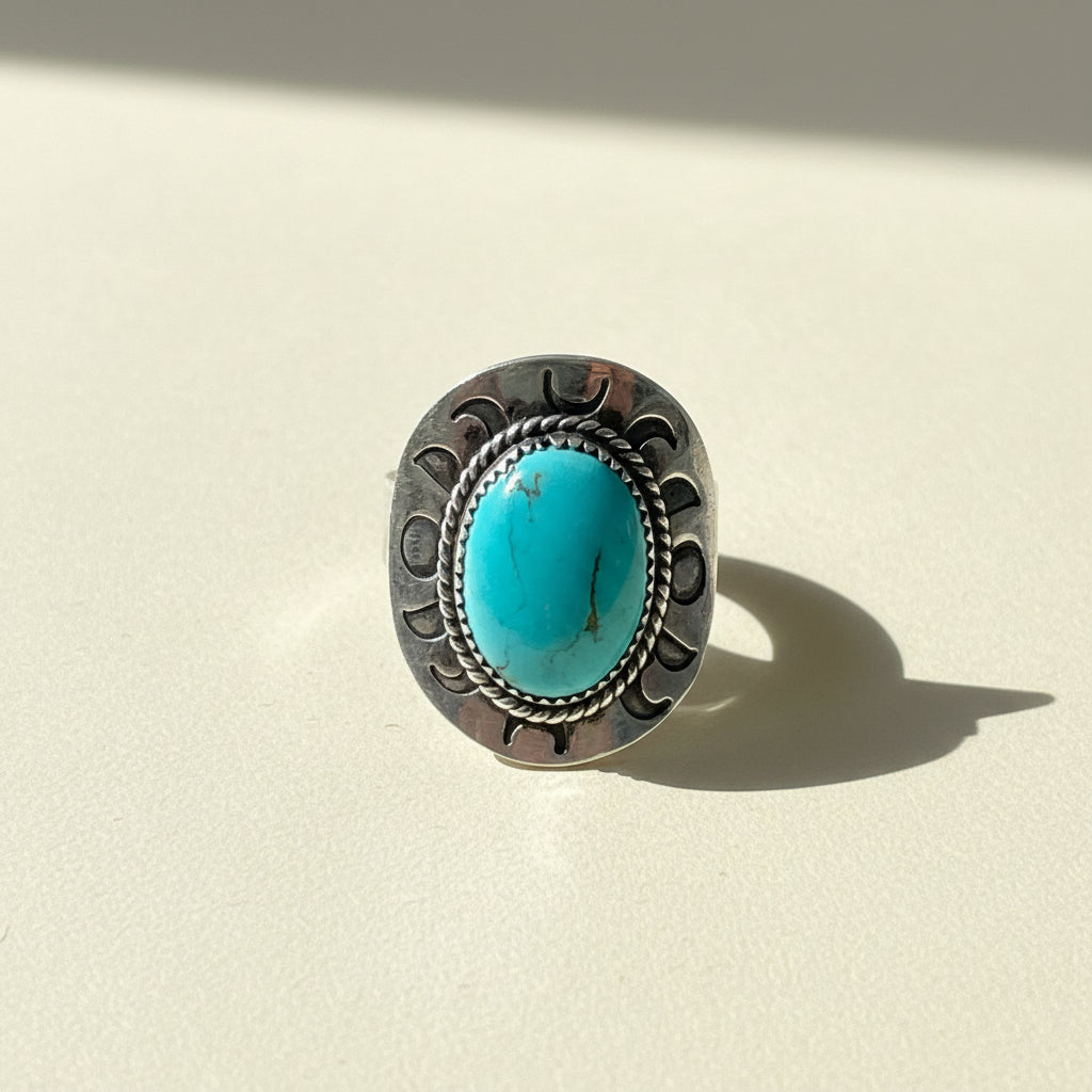 Turquoise oval cabochon silver-toned ring with engraved side details, size 11