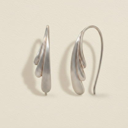 Silver pull-through hoop earrings with feather drop charm