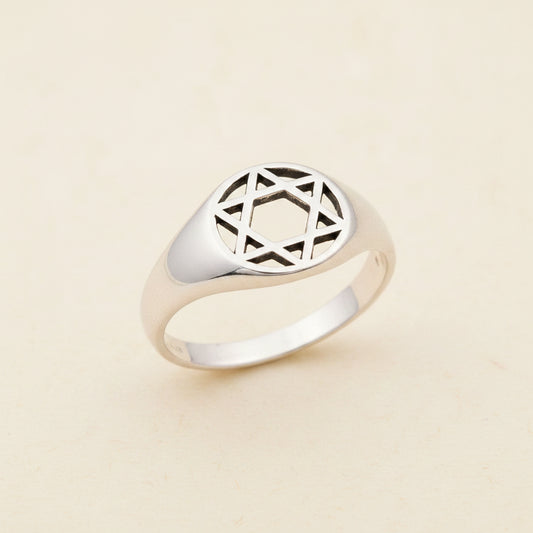 Sterling silver tone signet ring with engraved geometric star motif top