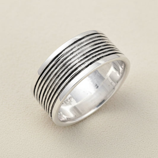 Wide silver-tone grooved band ring with oxidized ridged stripes