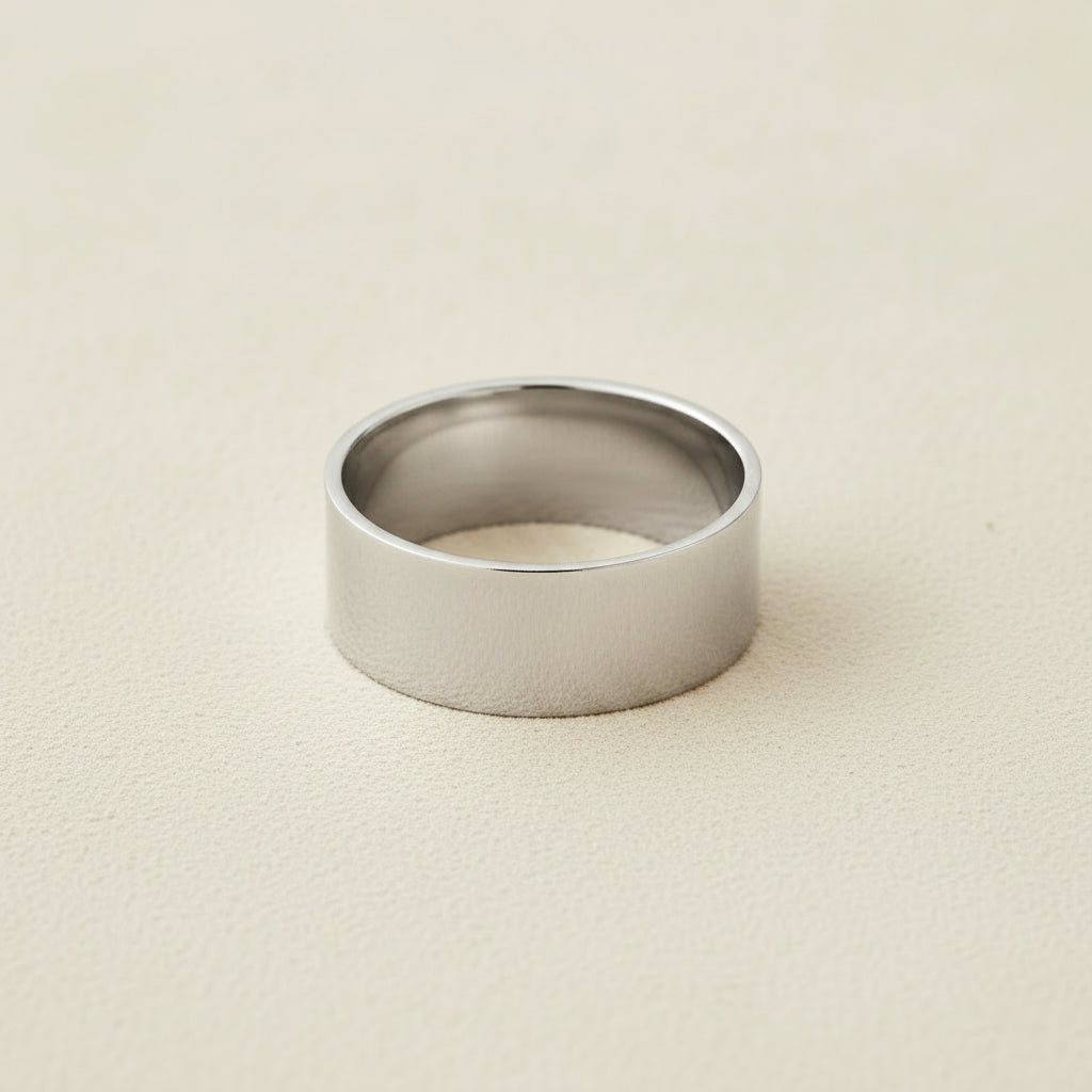 Wide silver-tone cigar band ring with smooth, flat top