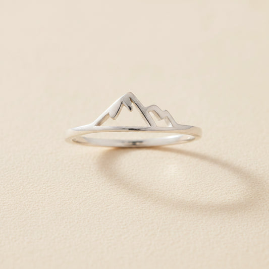 Silver mountain ring with raised peak and snowcap design