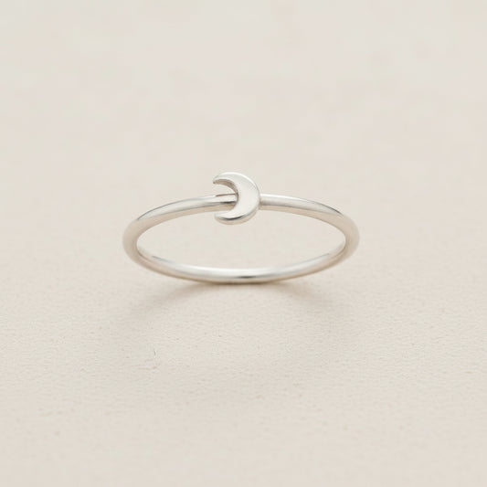 Silver crescent moon ring with smooth open band and small moon-shaped front detail