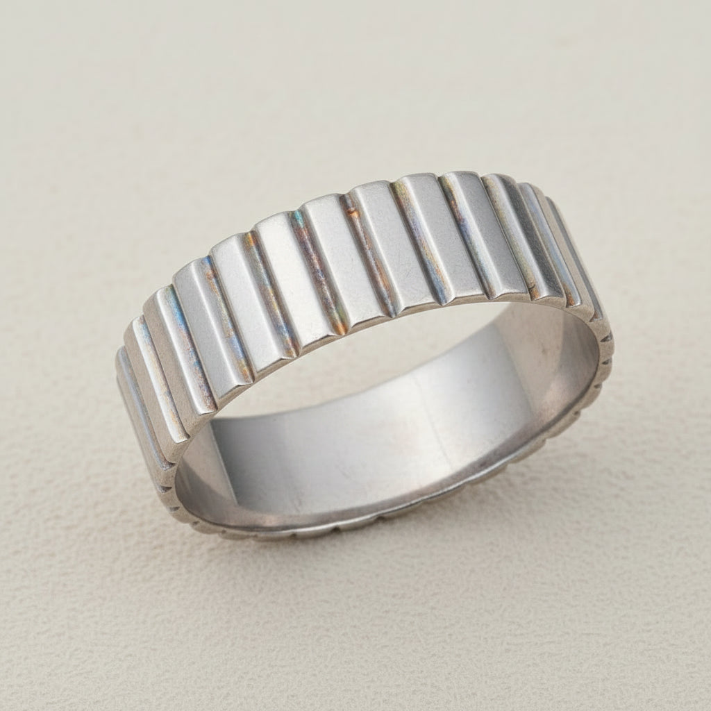 Ribbed band ring in silver tone with vertical ridged texture