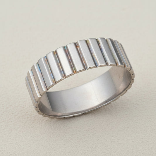 Ribbed band ring in silver tone with vertical ridged texture