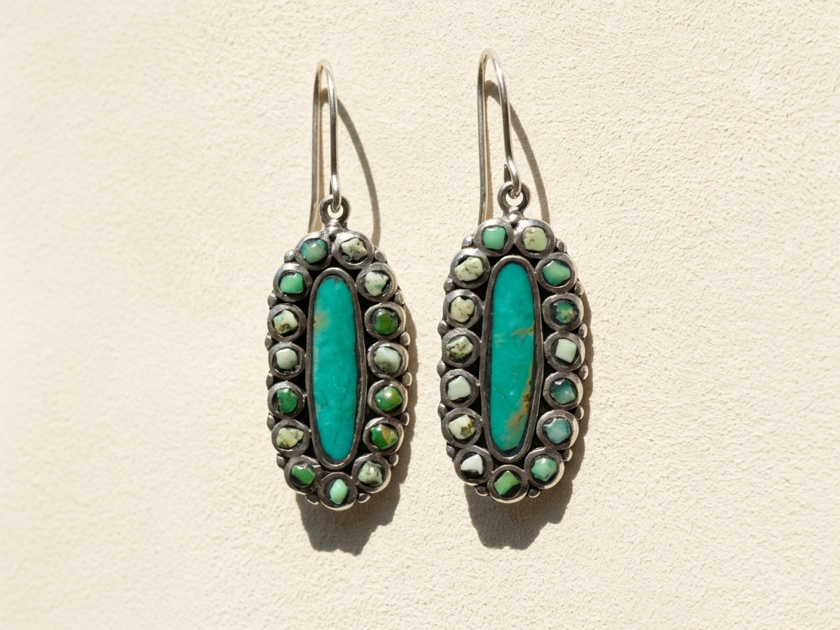 Turquoise oval hoop earrings with green and silver-tone bead accents