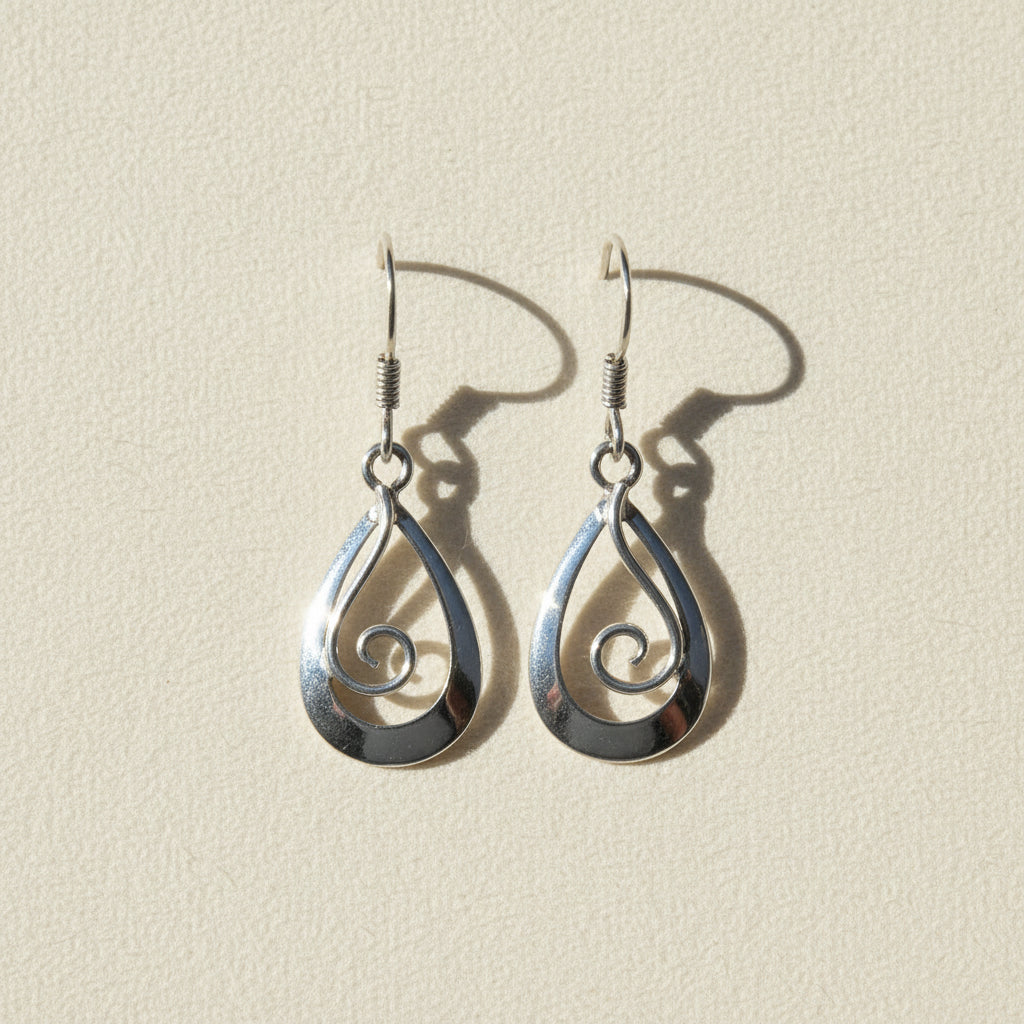 Silver teardrop earrings with spiral swirl detail and fishhook backs