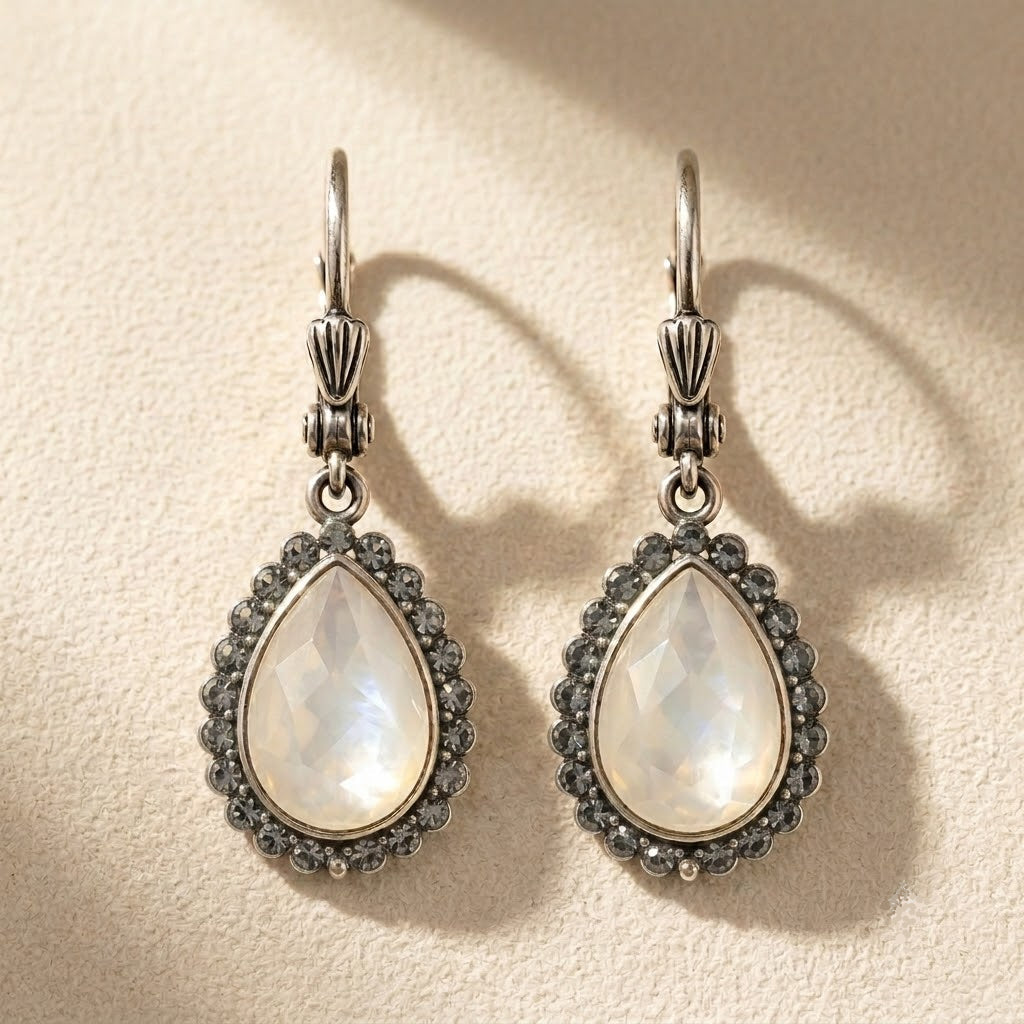 Teardrop crystal drop earrings with dark halo and silver-tone hooks