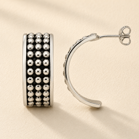 Silver beaded half-hoop post earring with rows of shiny round beads