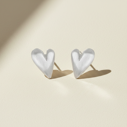Puffy heart stud earrings, metallic silver-tone, heart shape