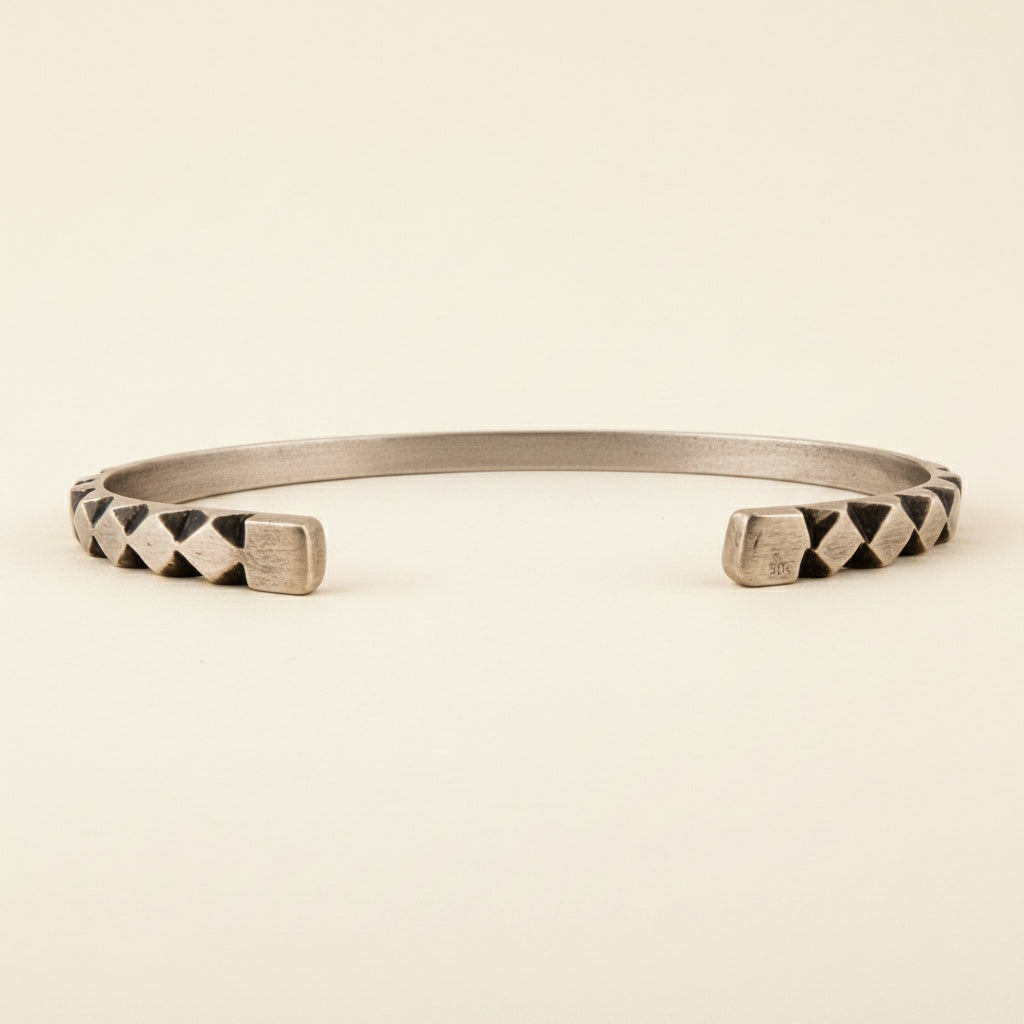 Hand-carved diamond pattern cuff bracelet, silver-toned with black geometric inlays