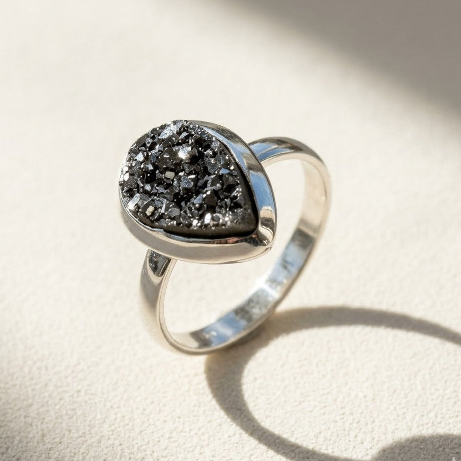 Teardrop druzy ring with dark black glitter stone and silver band