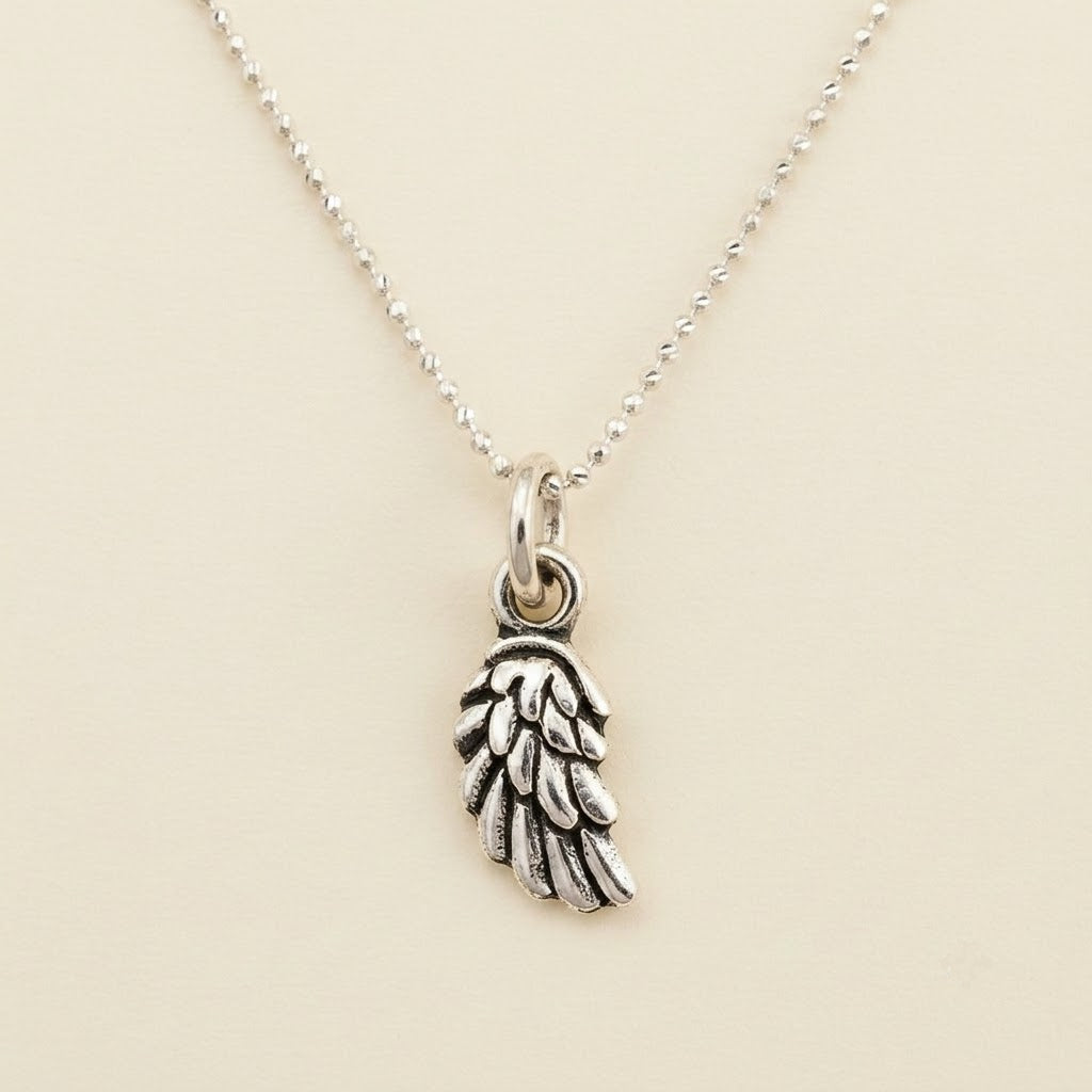 Silver bead chain necklace with wing charm pendant