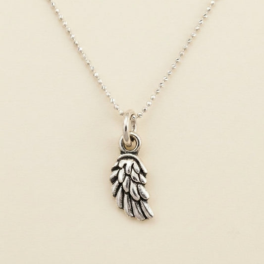 Silver bead chain necklace with wing charm pendant