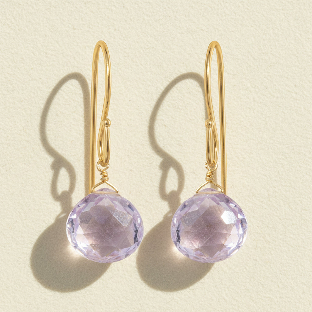Gold-tone drop earrings with faceted pink amethyst briolette