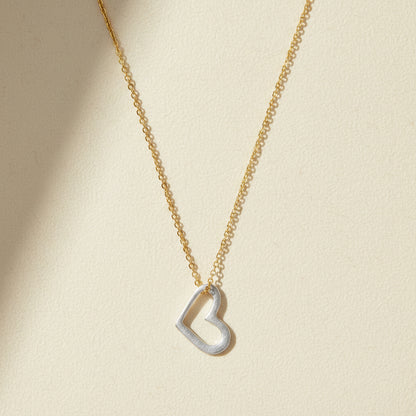 Gold-tone necklace with small open heart pendant on fine chain