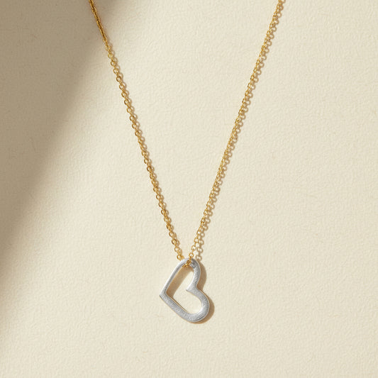 Gold-tone necklace with small open heart pendant on fine chain