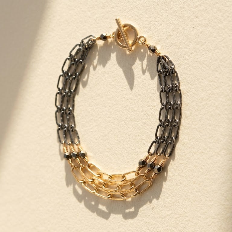 Two-tone hammered chain bracelet with gold clasp, linked silver and gold sections
