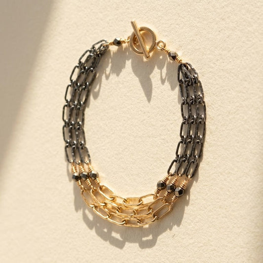Two-tone hammered chain bracelet with gold clasp, linked silver and gold sections