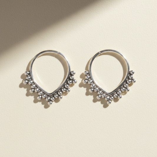 Beaded hoop earrings with small silver-tone bead fringe and teardrop outline