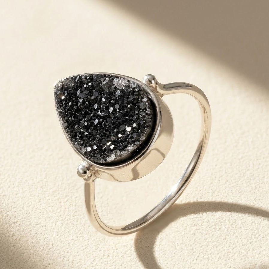 Sterling silver teardrop druzy ring with black stone, open scalloped setting