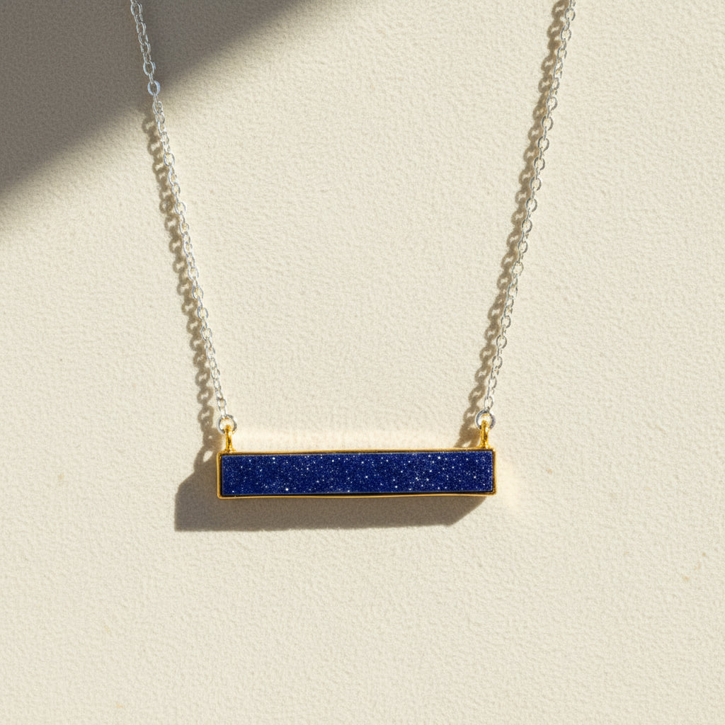 Two-tone druzy bar necklace with dark blue rectangular pendant on gold chain