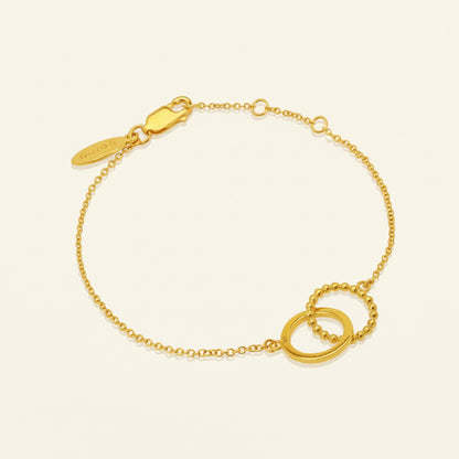 Gold bracelet with a clasp on a white background