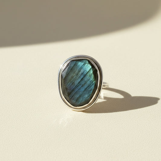 Sterling silver ring with large oval labradorite gemstone, blue-green iridescence bezel