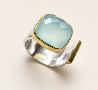 Gold-tone statement ring with square turquoise cabochon set in bezel