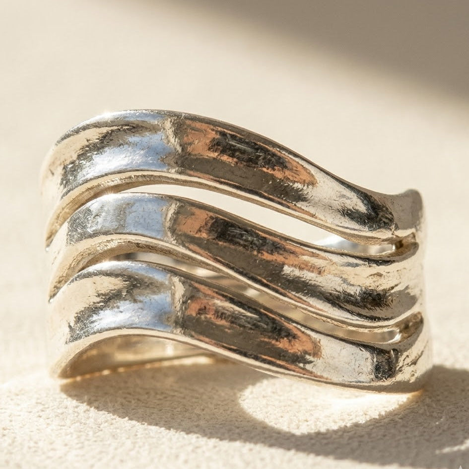 Triple wave ring with three shiny silver-toned wavy bands