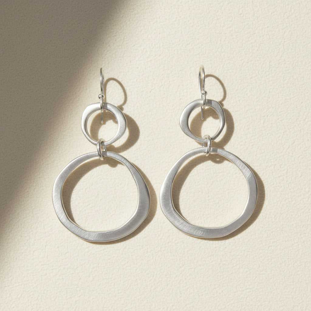 Silver circle drop earrings with small top hoop and large ring drops, lever-back