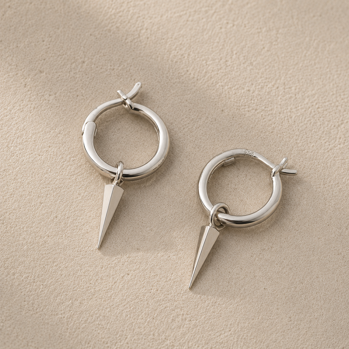 Silver spike hoop earrings with pointed drop charm