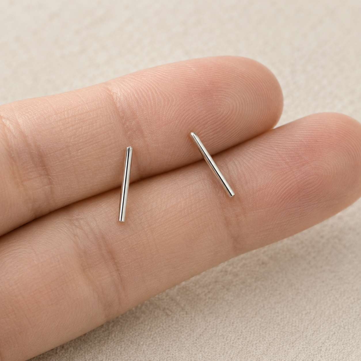 Silver bar stud earrings, slim straight bar posts on close-up