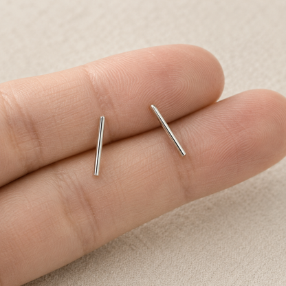 Silver bar stud earrings, slim straight bar posts on close-up