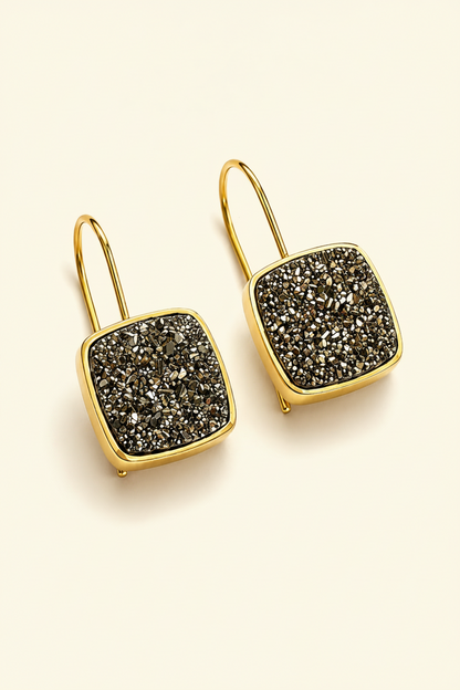 Gold square druzy drop earrings with dark glittering druzy centers and curved hooks