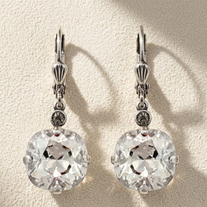 Antique silver drop earrings with large round faceted crystal stones and small clear accents