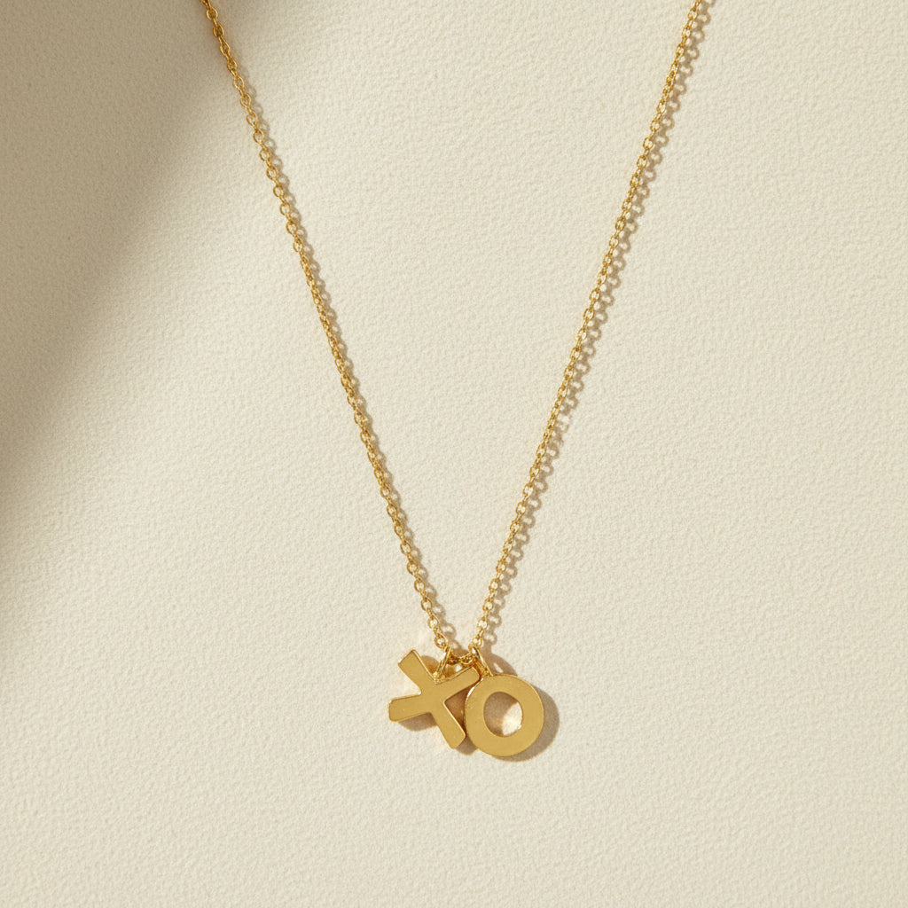 Gold-tone XO pendant necklace with fine chain