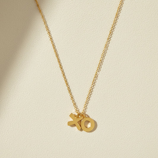 Gold-tone XO pendant necklace with fine chain