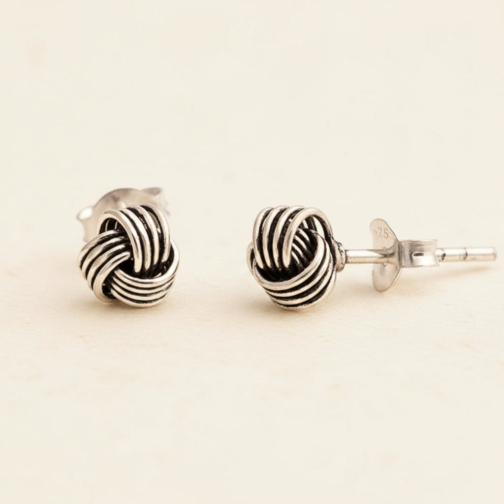 Silver oxidized knot stud earrings with twisted rope-like loop design