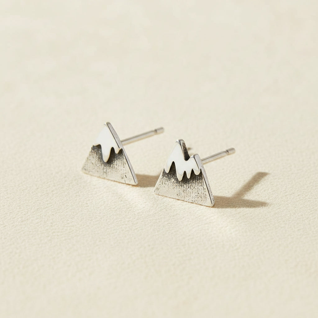 Mountain stud earrings with snow-capped peaks, silver-tone metal.