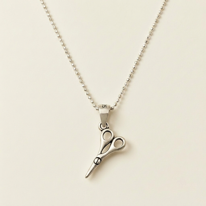 Silver pendant necklace with scissors-style charm and bead chain