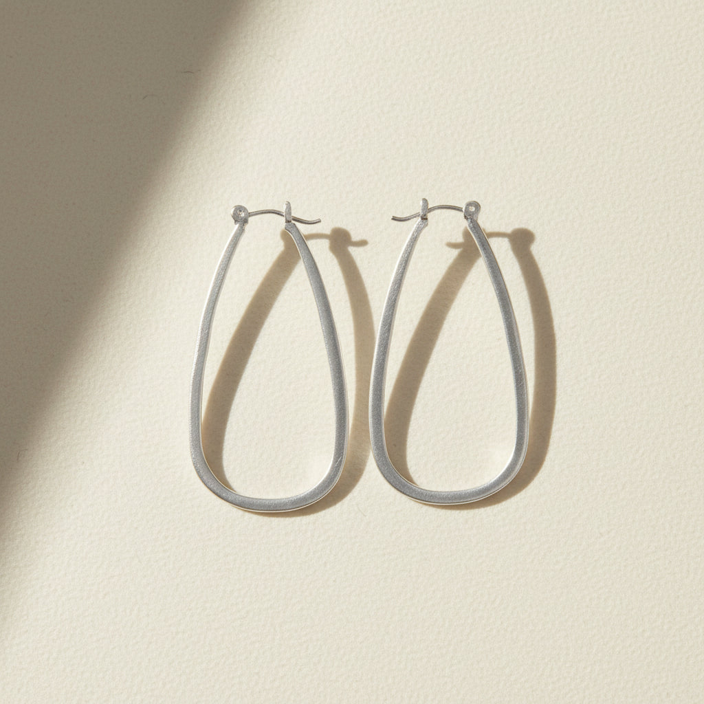 Large silver teardrop hoop earrings with hinge hook closure
