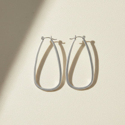 Large silver teardrop hoop earrings with hinge hook closure