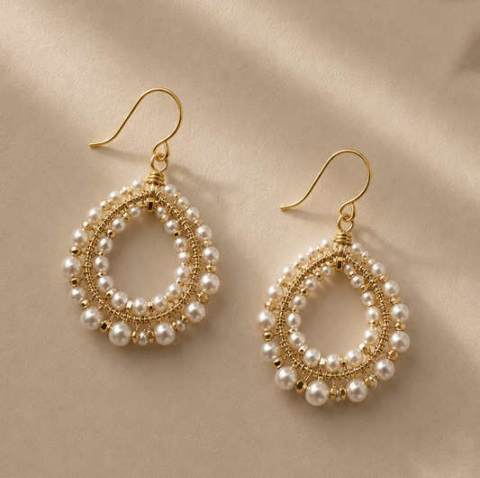 Gold-tone drop earrings with woven pearl circular hoops and dangling pearl fringe